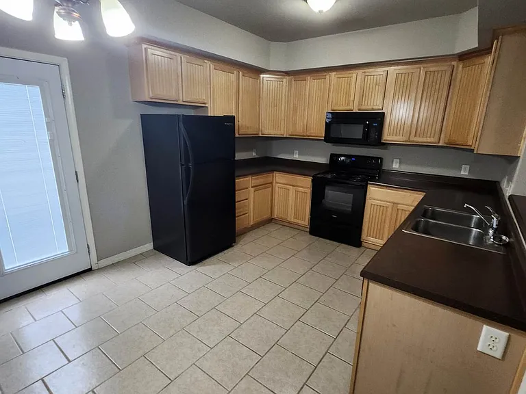 Kitchen with refrigerator, range and dishwasher