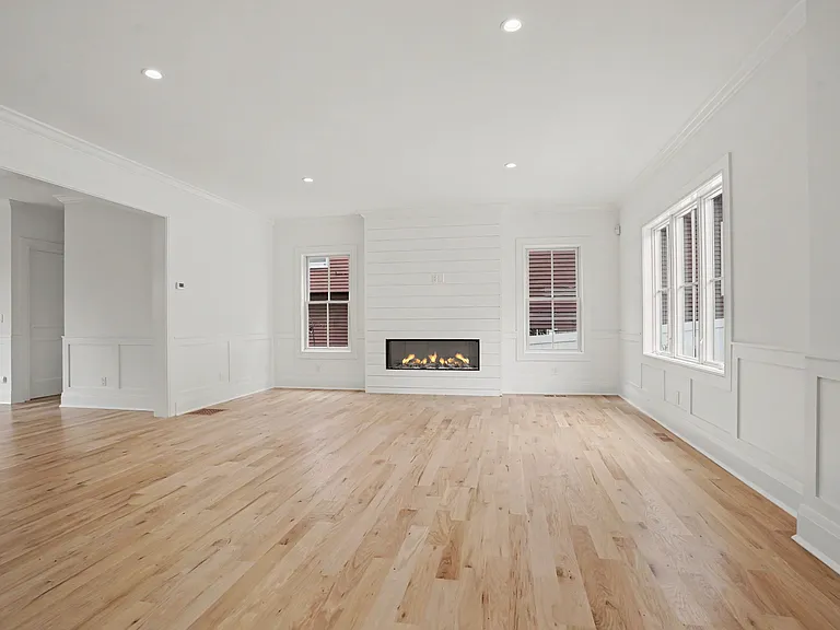 A Spacious Open Floor Plan Anchored by a Gas Fireplace, Complemented by Bright, Light_Filled Living Spaces.