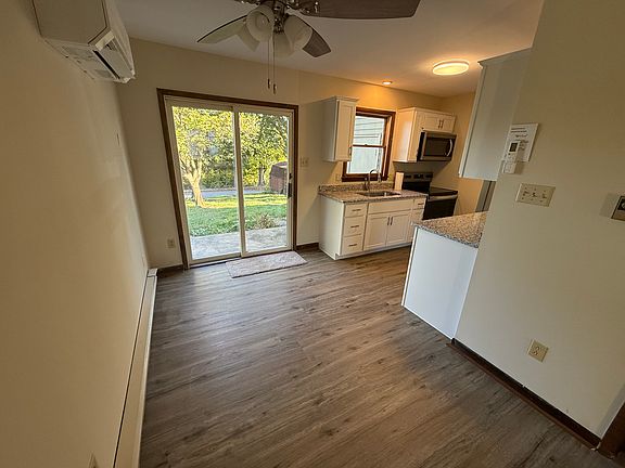 Walk into this brand new kitchen featuring new cabinetry, flooring, granite countertops, and stainless steel appliances