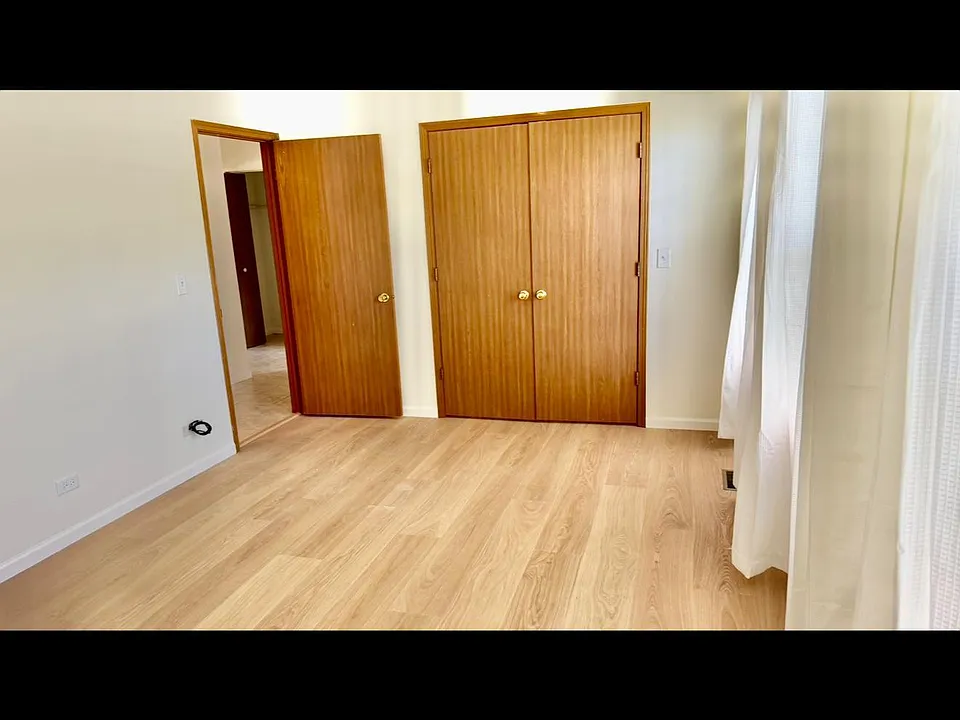 Newly added wood floors in bedroom
