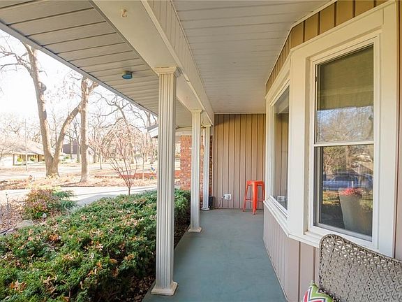 Another view of the front porch. There is also pretty exterior lighting.