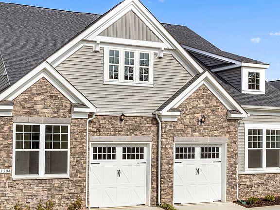 Exterior view of the Appalachian, a low-maintenance two-story villa with a main level owner s suite
