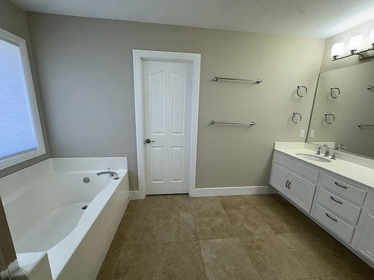 Master bathroom with separate tub and shower and double sinks