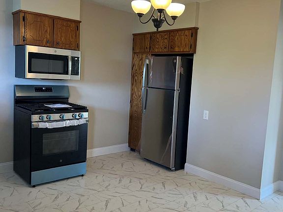 Kitchen
- New flooring
- New paint
- New lighting
- New appliances
- Refurbished cabinets