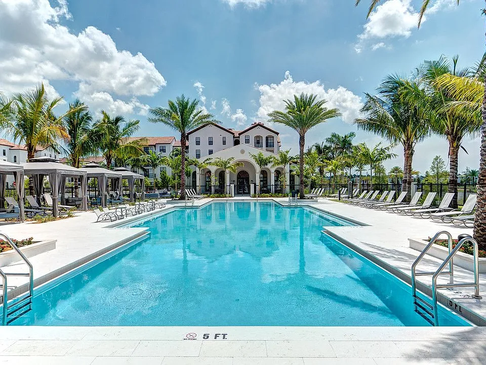 Resort Style Pool with Private Cabanas and Expansive Sunning Deck