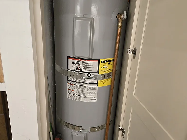 Full-size 50-gallon hot water heater concealed behind custom panel