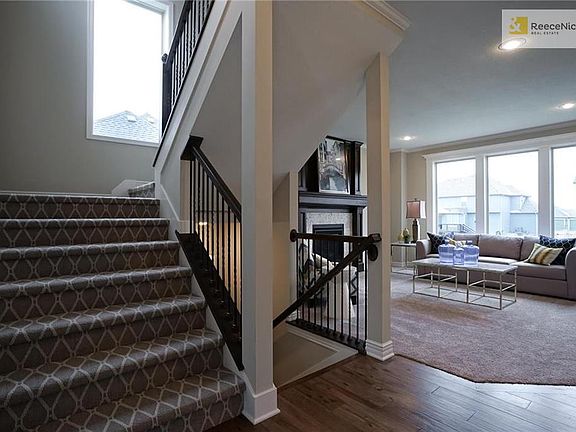 STAIRWAY UP AND DOWN AND GREAT ROOM