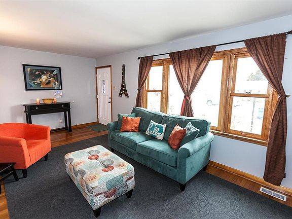 Inviting living room offers plenty of space for entertaining. Exceptional features include hardwood flooring, professionally pai