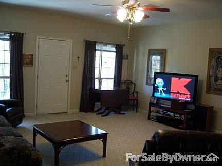 Large Living Room w/new hard wood floors
						:
						Woodburning fireplace insert