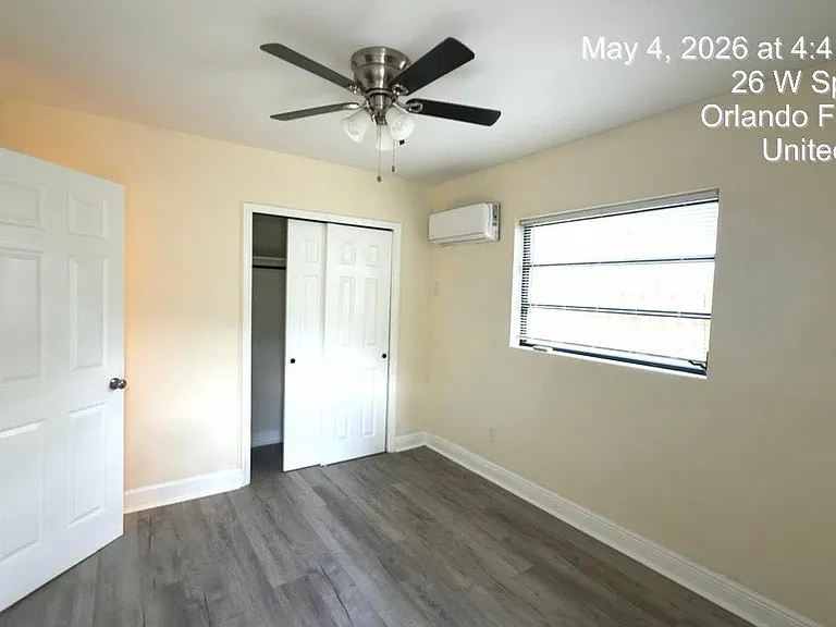 Bedroom with door to backyard.