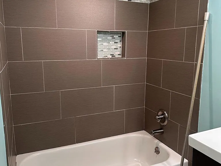 Guest Bathroom - Tub with updated faucet fixtures