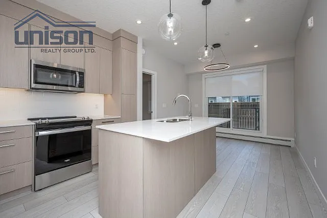 265 Wolf Willow Blvd SE #2115 — Photo 33