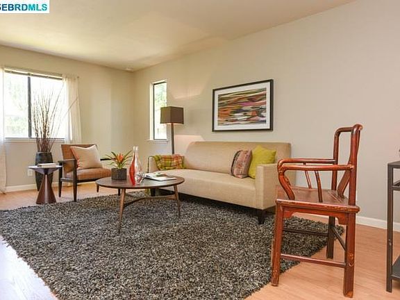 Family room (since photo taken a fan has been added, floors are updated to grayish brown, walls have been painted)