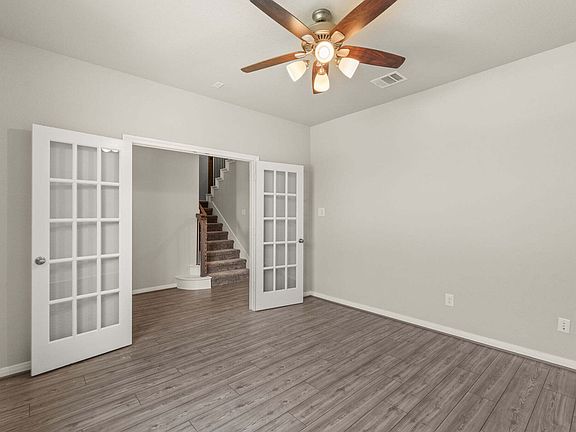 An additional view of the study and French doors