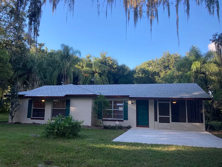 Lush vegetation surrounds this house on a huge lot with few neighbors.