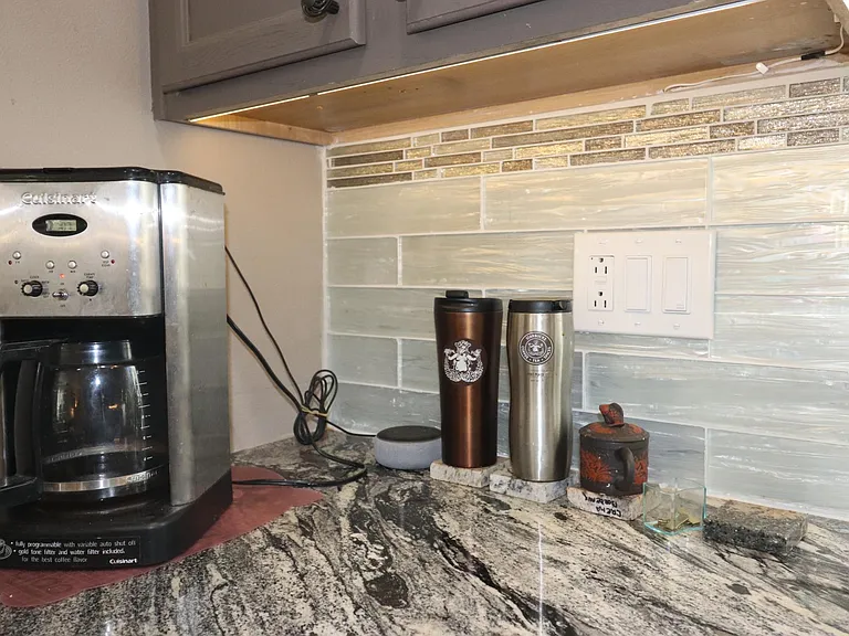 Granite countertop with tile backsplash