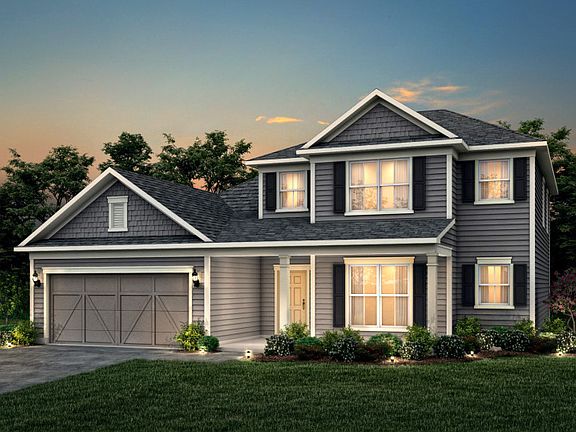 Furman Exterior 52 features Hardie Board siding, shakes, covered front porch and 2 car garage