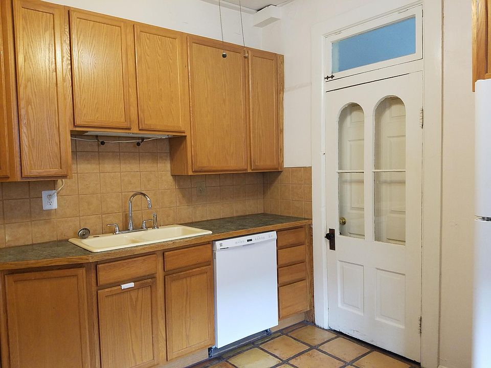 Kitchen. Rear exit to laundry and back yard.