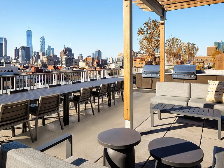 Rooftop terrace with lounge seating and grilling stations