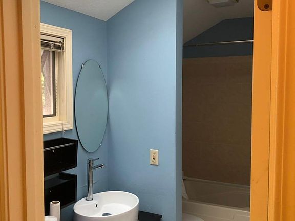 Master bathroom also has a window for view and natural light.