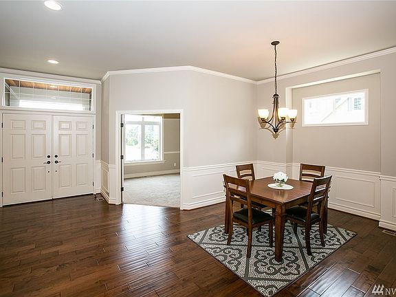 Double door entry with top lights that provide extra natural light. Large enclosed den off entry. Formal dining with butlers pan