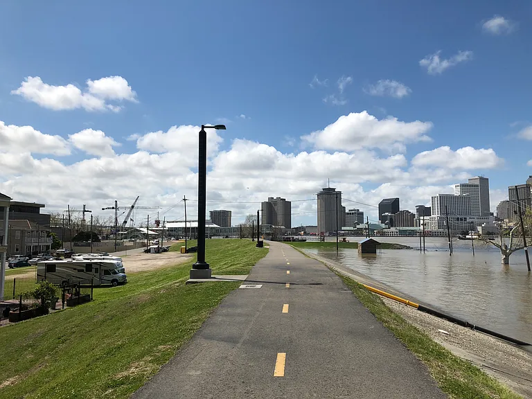Across street from Penthouse is Levy with paved walk way with view of Miss. River/City/French Quarter