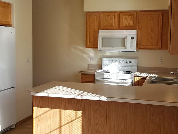 Kitchen view from the dining area with breakfast bar.