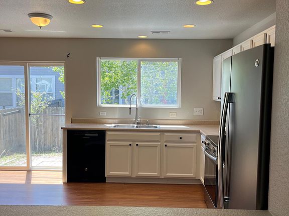 Spacious eat in kitchen overlooking backyard.