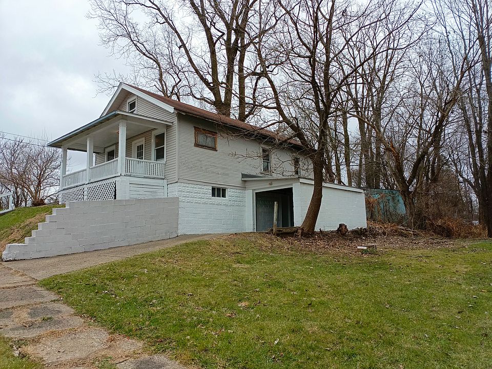 SINGLE CAR GARAGE, NO DOOR, THERE IS AN ENTRANCE TO BASEMENT