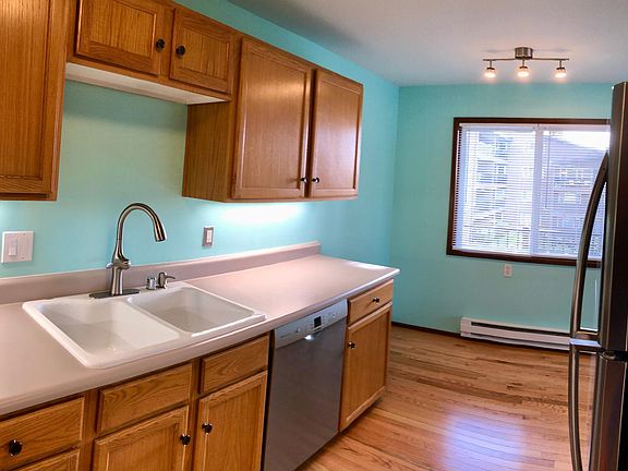 Kitchen sink and view to dining area window.