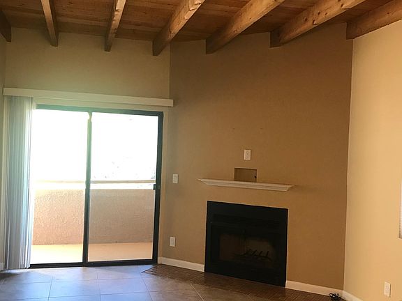 living room with fireplace, fresh paint