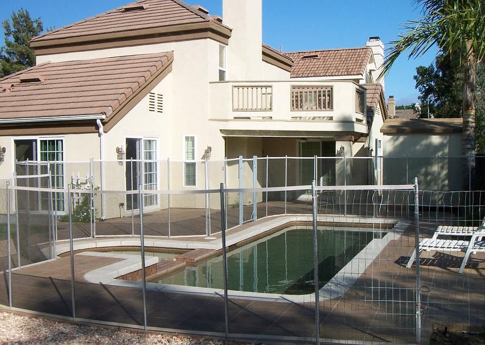 Backyard pool is completely fenced. Approximately 900 feet of stamped concrete. Balcony off of upstairs primary bedroom. Covered patio underneath with outdoor ceiling fan and lighting.