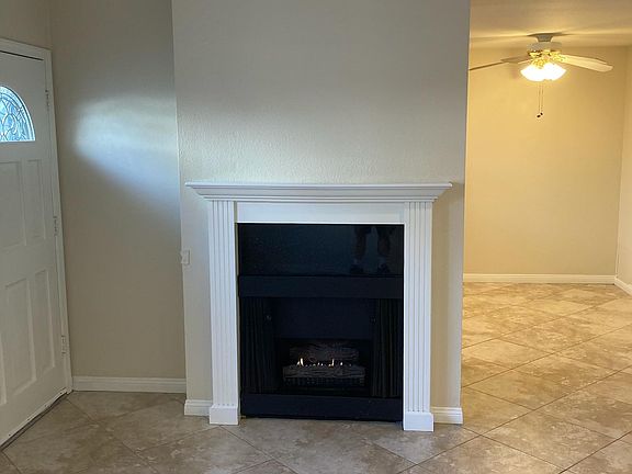 Decorative gas fireplace and living room.