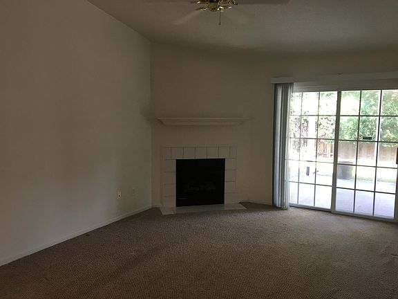 View of the great room from the end of the kitchen.  Mantle 