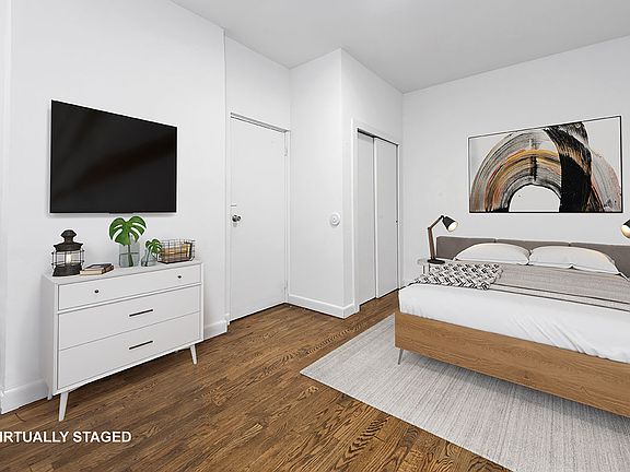 3rd image of 150 E 3rd St APT 1A