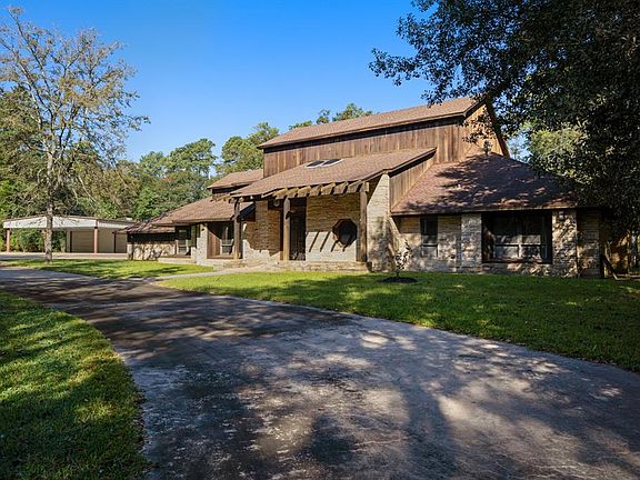 Well over two acres of privacy with gated circle drive.