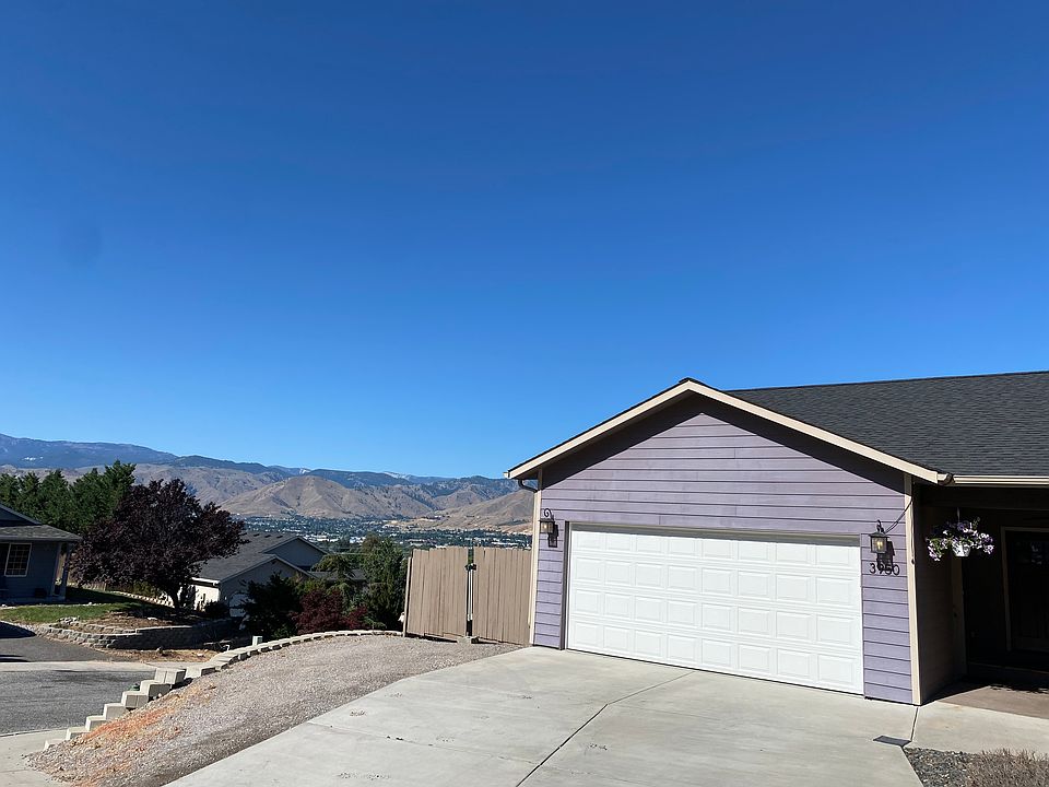 Corner lot, with Trailer/Boat storage through the fence, left of the garage. Garage storage comes with the appartment. Parking in driveway and street available.