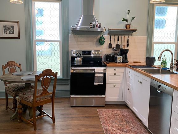 Stainless Convection Oven, Range Hood, Dishwasher, and Refrigerator