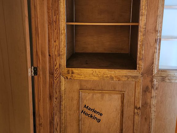 Built in storage in the hall outside the main bathroom.