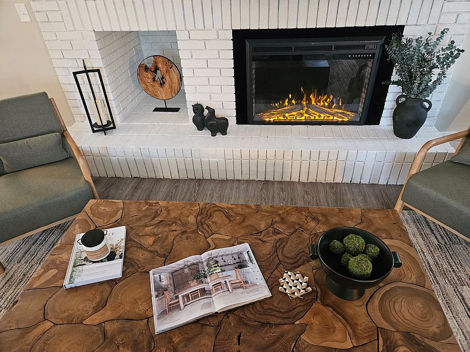 clubhouse with a fireplace and coffee table