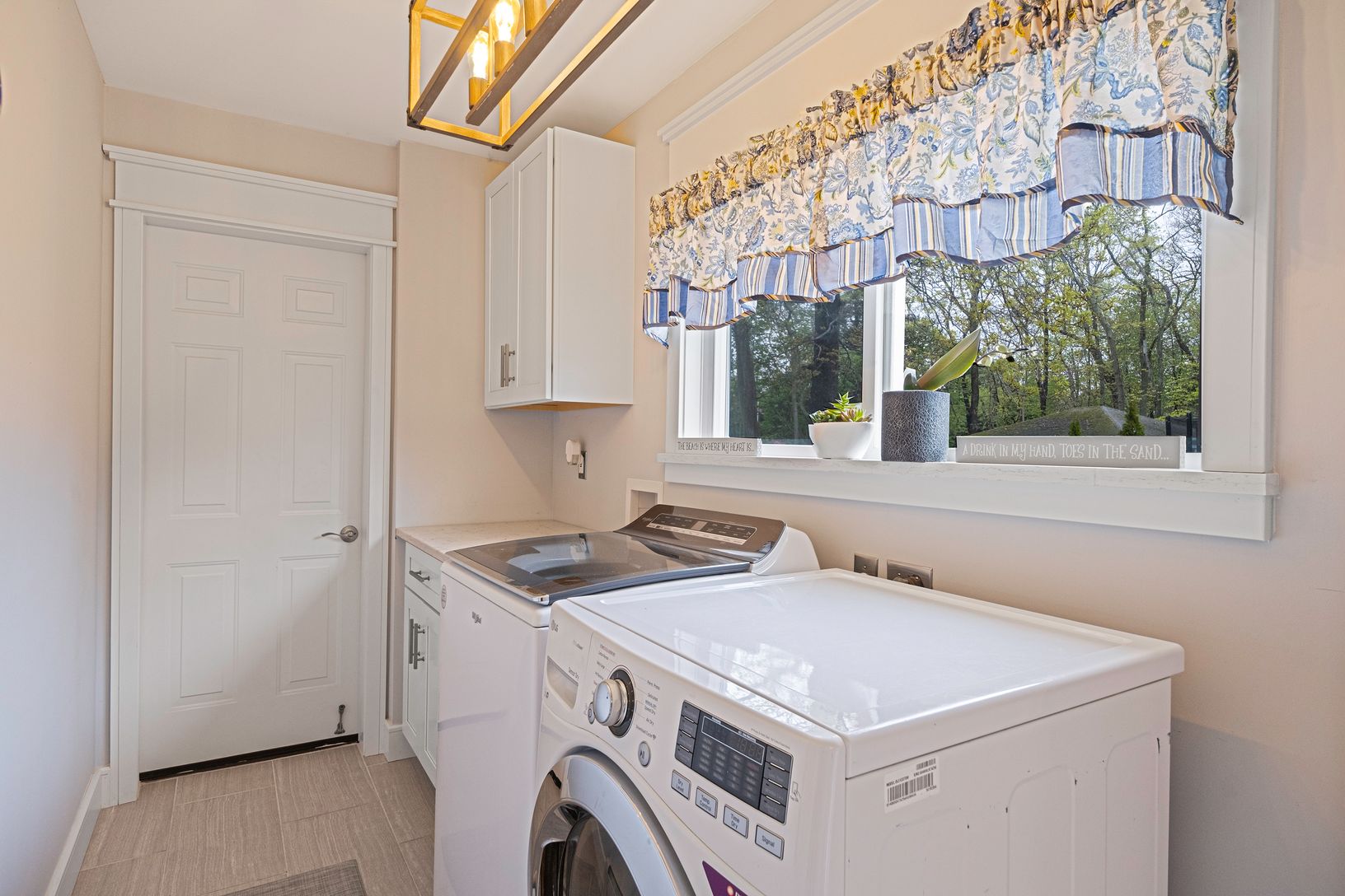  First Floor Laundry with Access to Boiler Room and Garage