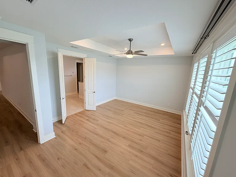 Spacious master bedroom with stunning water views