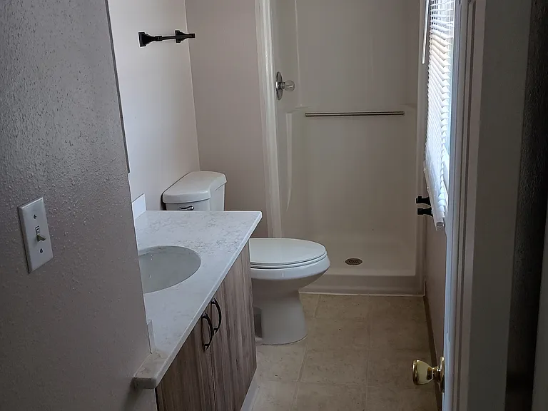 Upstairs 3/4 bath with quartz vanity countertop