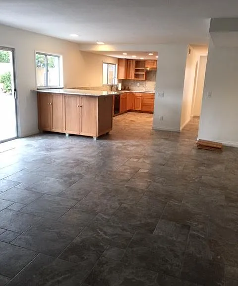 huge family room with fireplace & view into kitchen