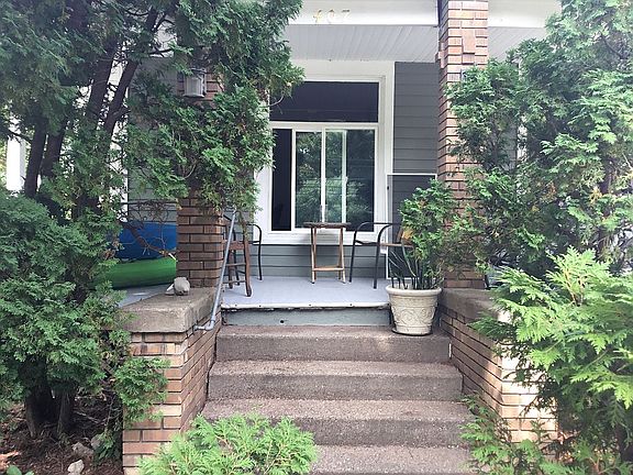 Steps up to porch.