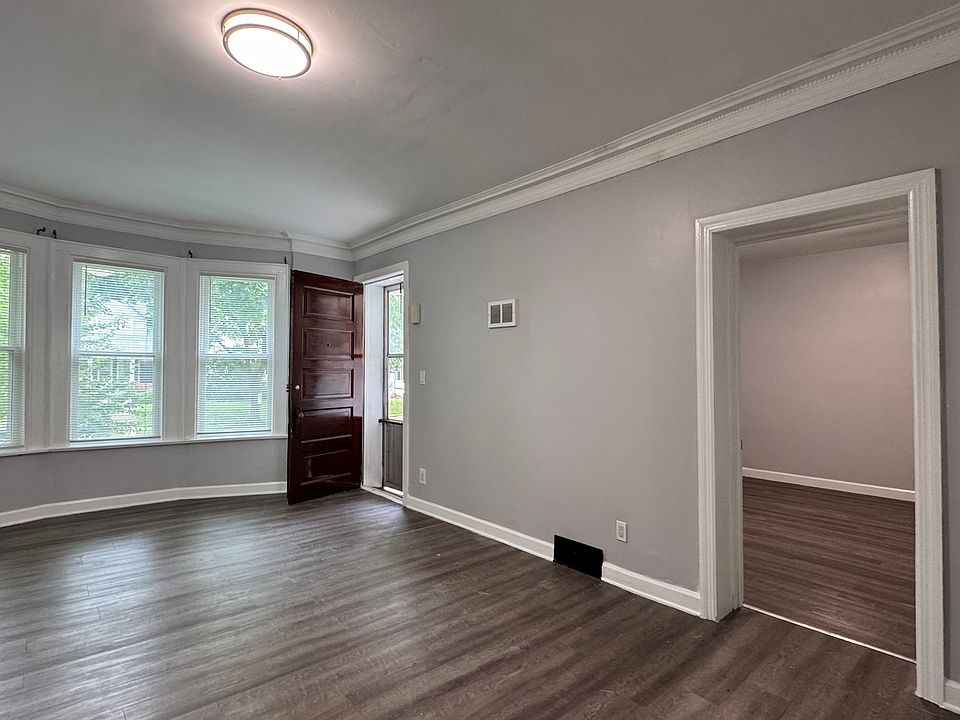 Front entry to living room, fireplace on other wall