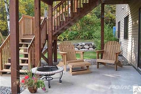 Walk out from the lower level onto this patio and then to the spacious back yard.