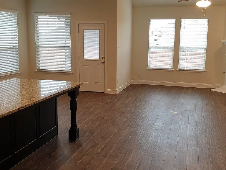 A view of the family room, gas fireplace and dining area