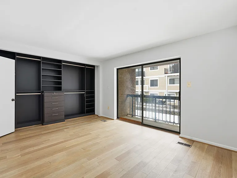 primary bedroom closet (The Container Store) and balcony