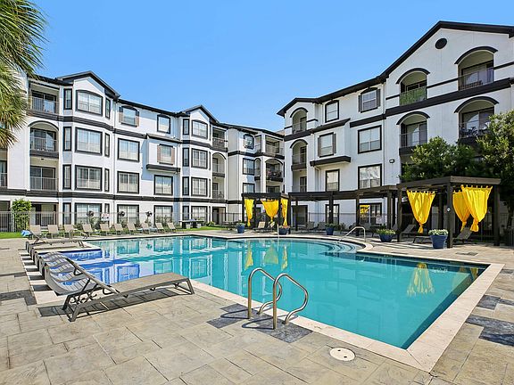 Lounge by the pool or catch some sun on the tanning deck at Providence Uptown, Houston's premier apartment community.